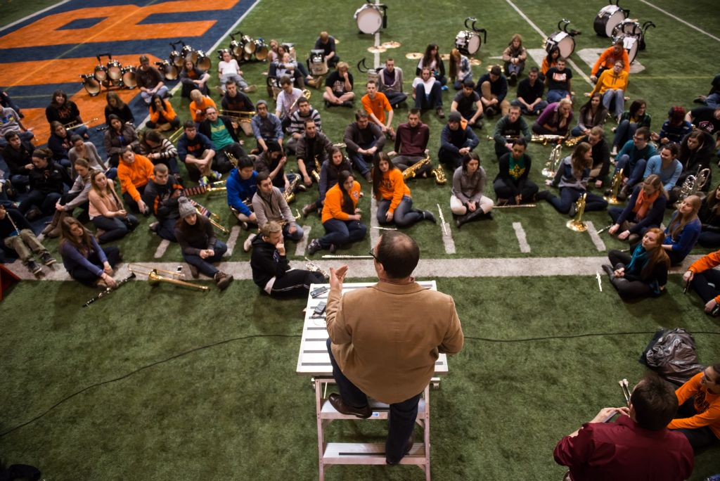 Justin Mertz gives final instructions to the Syracuse University Marching Band (SUMB) during practice on Wednesday at the Carrier Dome before before their performance at the Super Bowl on Sunday.  SUMB was selected along with the Rutgers Marching Band to perform as a part of the Super Bowl XLVIII pregame show. "There was a lot of planning put into it," Mertz said. He began coordingating with the Rutgers band director the moment they found out they would be playing togther, months before the actual performance date.