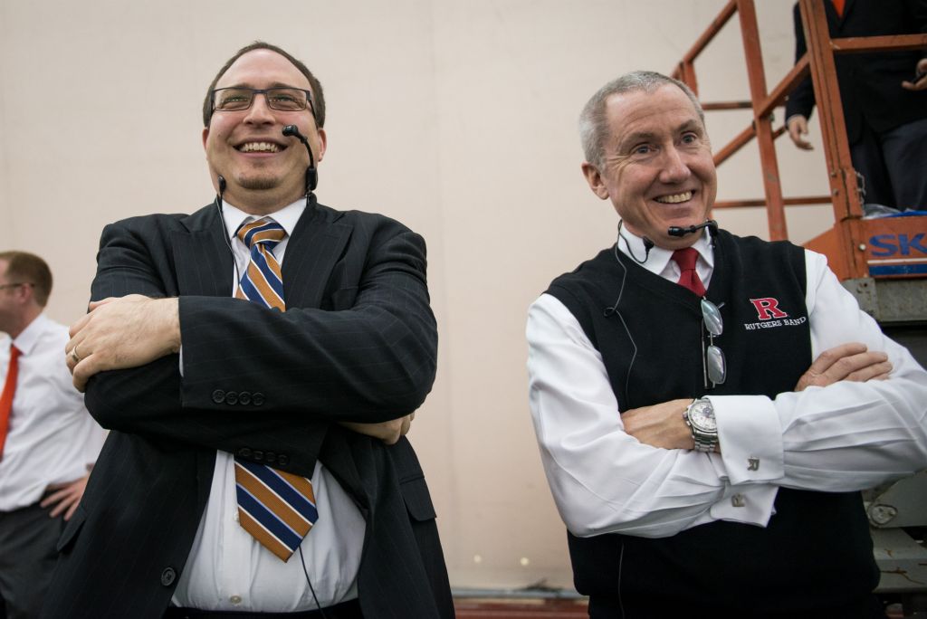 Justin Mertz, left, and Rutgers veteran director of athletic bands Timothy Smith grin as they listen to their bands performing together for the first time on Sunday morning. "It's so loud!" Mertz exclaimed.