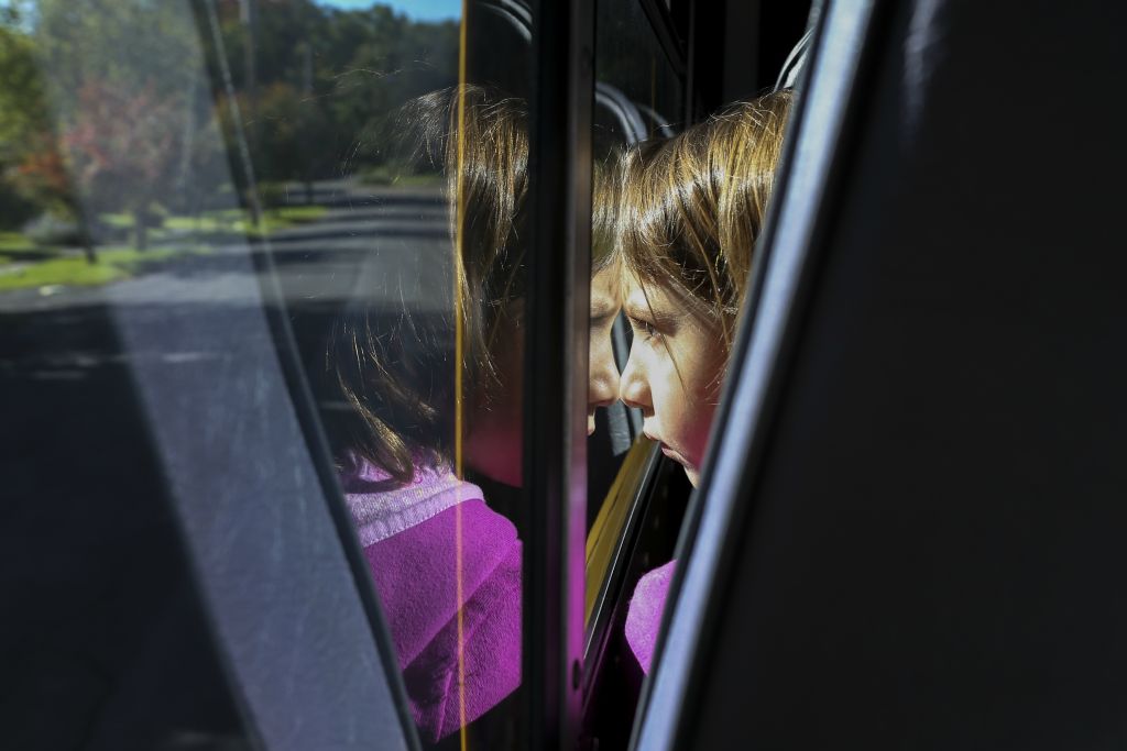 First-grader Tammy Greenblatt enjoys the bus ride to school on October 13, 2016. Students arrive at 7:55 a.m. to start the day off with an all-school assembly.