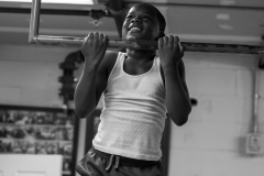 Da'vonne has been coming to classes at the gym since he was 4 years old. He and other boxers show off their pullups to on another during practice on Oct. 9.