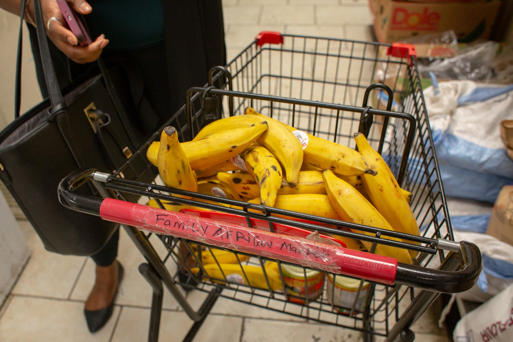 Kate and Pamela stock up on ripe plantains during their weekly shop at the Family African Market. "I'm here to buy stuff that I can't find in the big stores, like Walmart or Meijer. I'm used to buying my food [at Family African Market] because it reminds me of where I come from," Kate says before shopping.