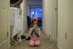 Kenza, 5, one of Mamba Hamissi and Nadia Nijimbere’s twin daughters, plays with a doll in their apartment in Grosse Pointe Park, Mich. Nadia fled Burundi in 2013 when she was violently targeted for her work with a human rights organization. Nadia chose to go to Detroit, a city she heard about because of a shelter called Freedom House which provided pro-bono housing, social, and legal services to asylum-seekers. By the time Mamba's visa was finally accepted in 2015, he had missed Nadia's pregnancy, the twins' birth, and the first two years of their lives.