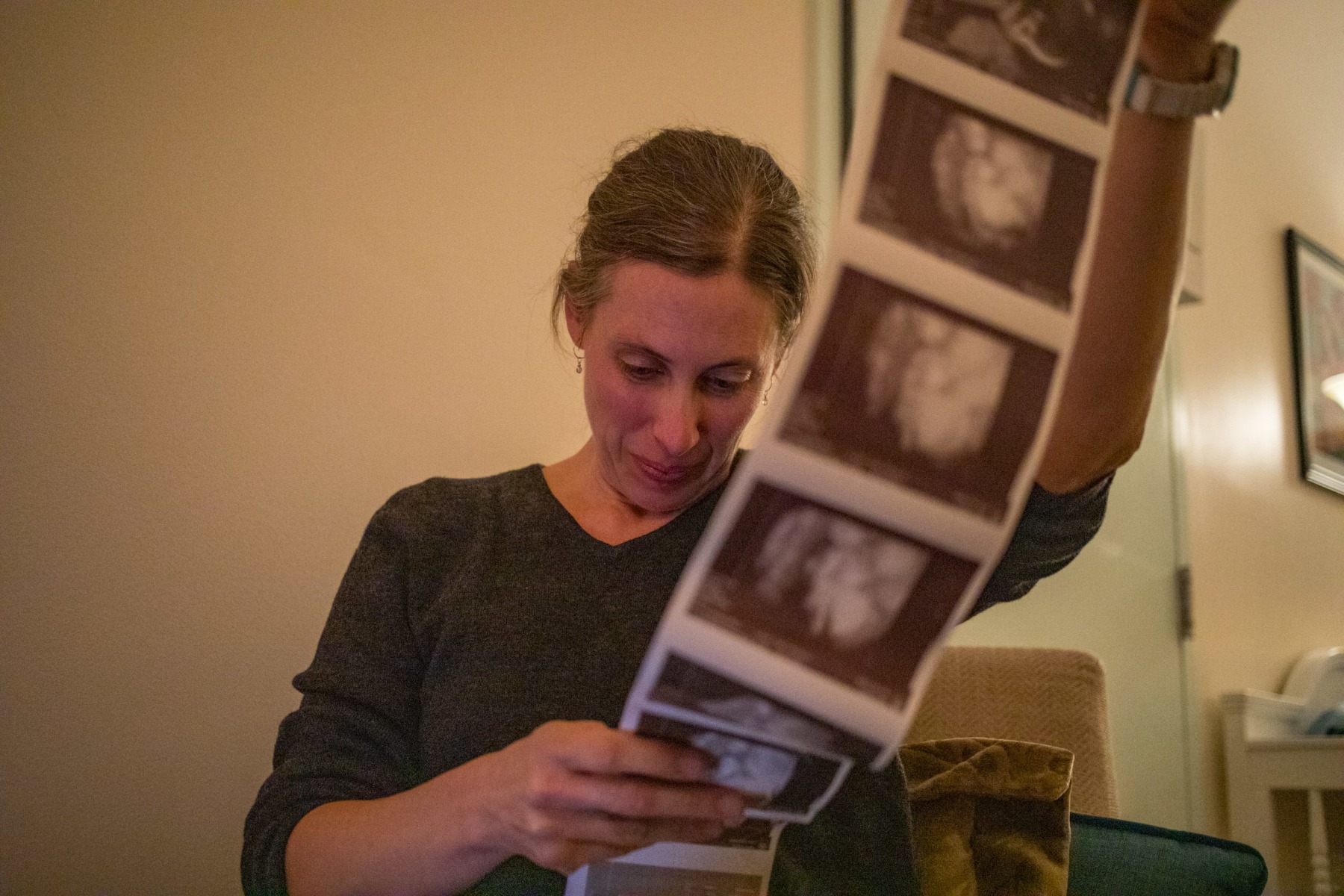 Lauren Genter looks over ultrasound pictures from her patient Kayla McGloin-Smith, of New Straitsville, Ohio, at her practice, Ohio Hills Midwifery, in Athens, Ohio, on Wednesday, November 13, 2019. Genter refers patients to the local hospital for ultrasounds and some testing because she is not a licensed nurse or medical professional. In Ohio, there are no regulations for non-nurse midwives.